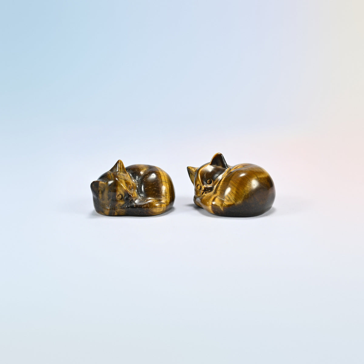 Two natural tiger eye sleeping cat crystal carvings, 1.5 inch, golden brown