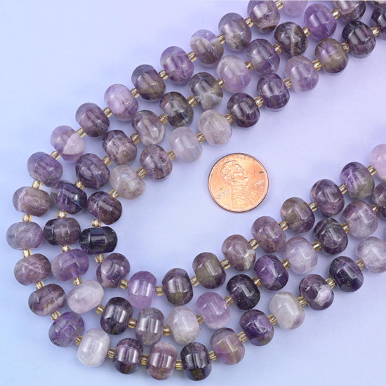 US penny resting inside the loop of the strands, giving true scale for the 12x8mm beads