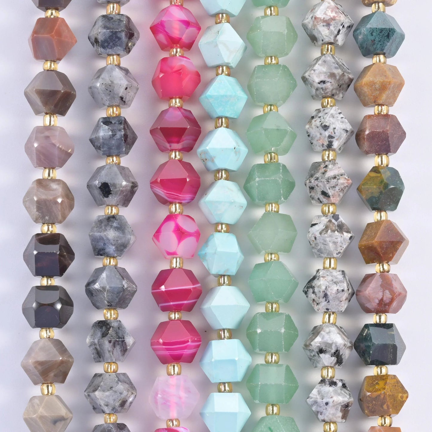 Faceted eight-sided diamond rhombus beads across speckled grey, aqua blue, magenta, sage green and multicolour stones