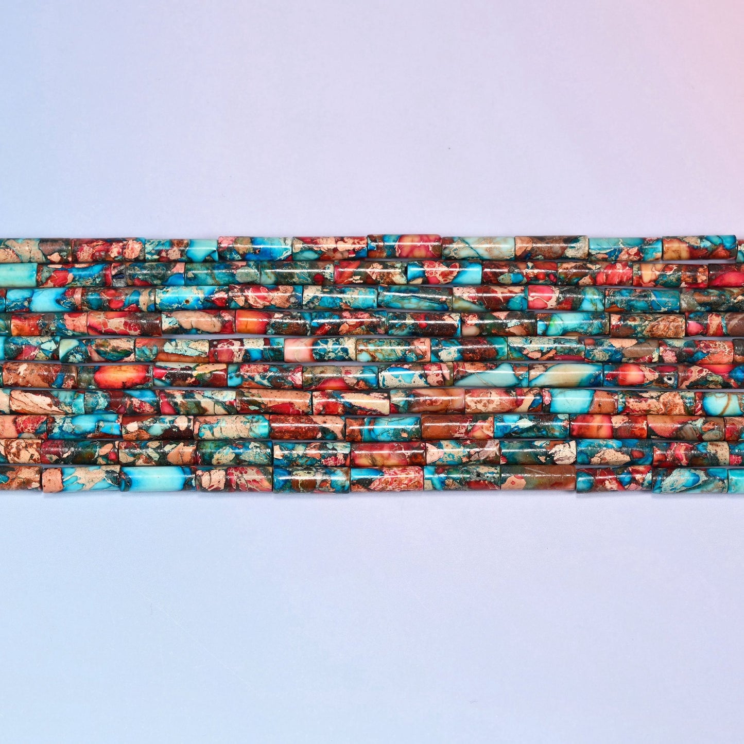 Sea Sediment Jasper Tube Beads in turquoise, coral red, rust brown and tan.