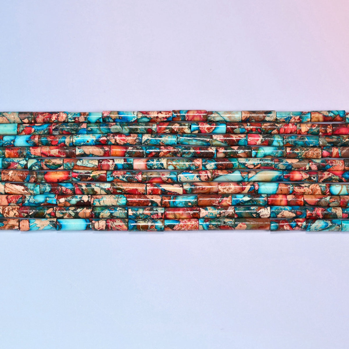 Sea Sediment Jasper Tube Beads in turquoise, coral red, rust brown and tan.