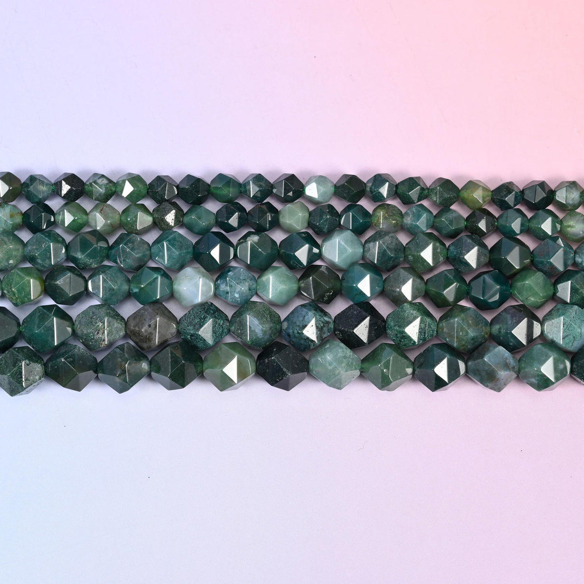 Moss Agate faceted beads in flat horizontal rows, green dendritic markings on translucent stone, sold per 15.5 inch strand