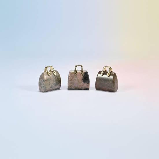 Three rhodonite purse crystal carvings, 1 inch, pink-brown natural stone with black patches, gold-tone handle