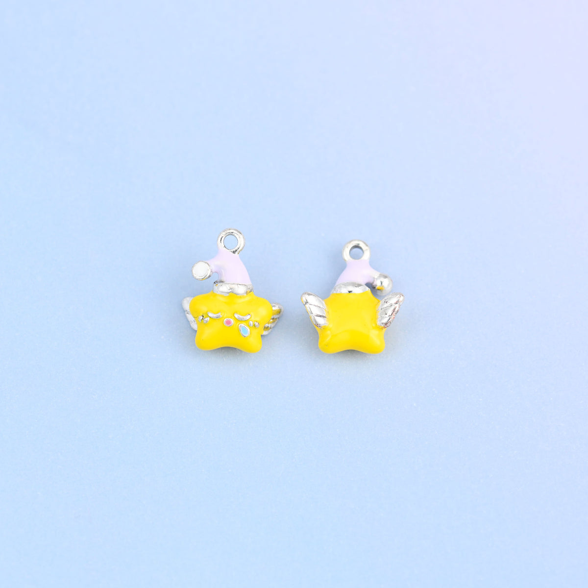 Two star charms in light purple hats, front and back, 18K white gold plated brass with yellow enamel.