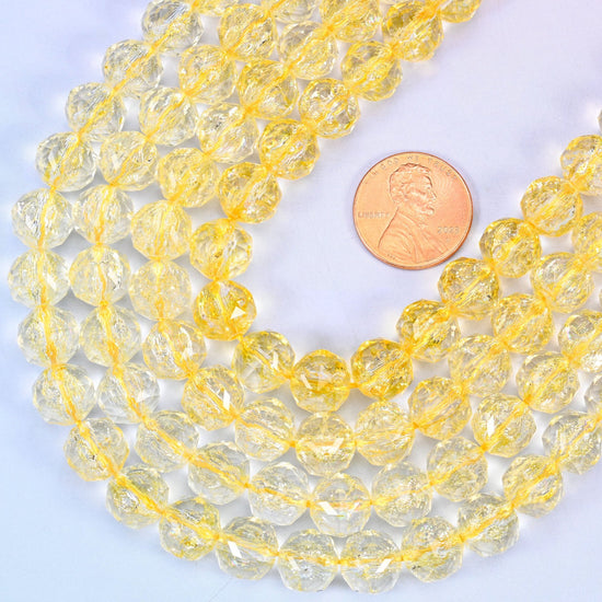 Faceted round cut transparent yellow glass beads