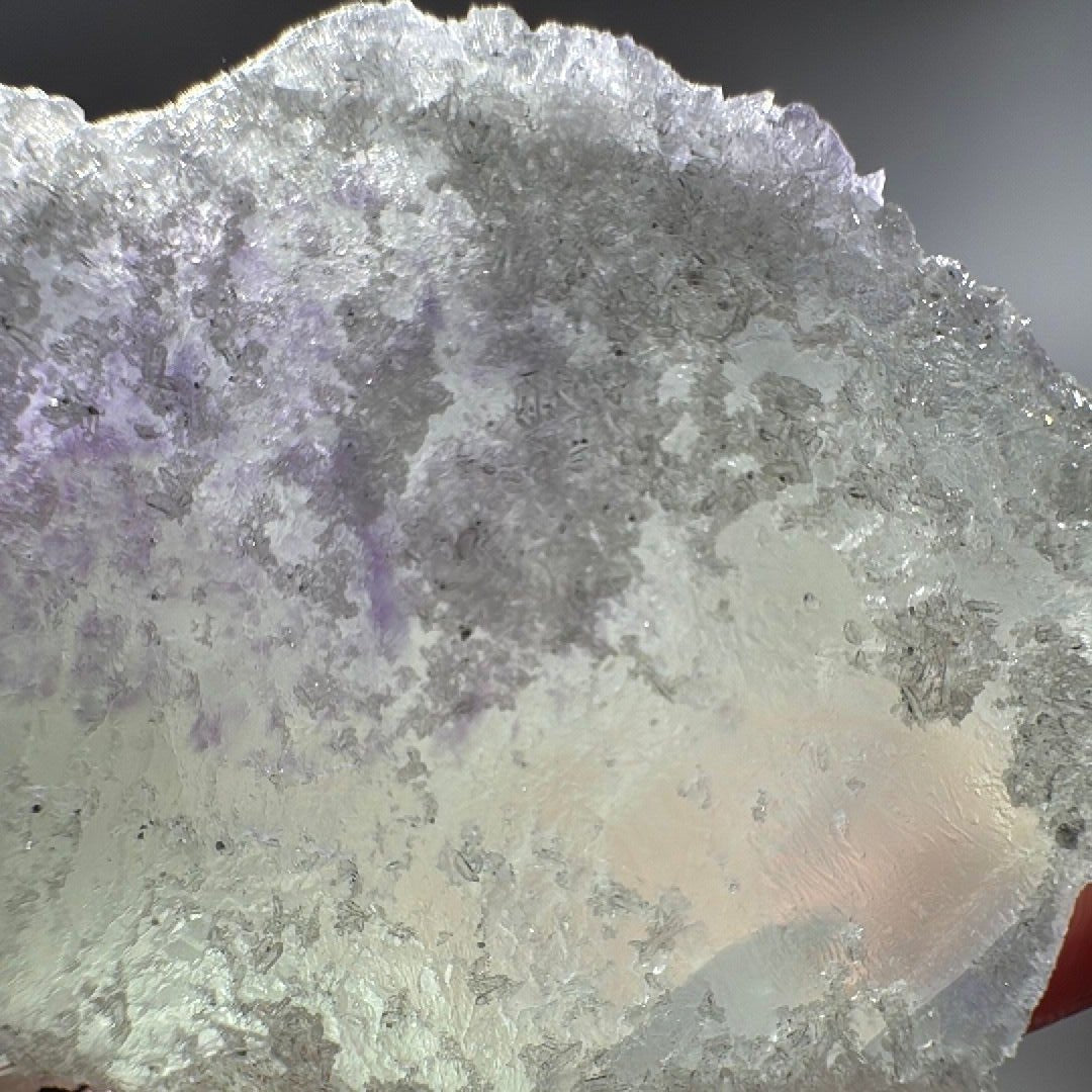 Top crust in close detail, frosty white quartz crystals spread across the green fluorite like sugar