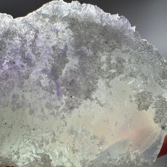Top crust in close detail, frosty white quartz crystals spread across the green fluorite like sugar