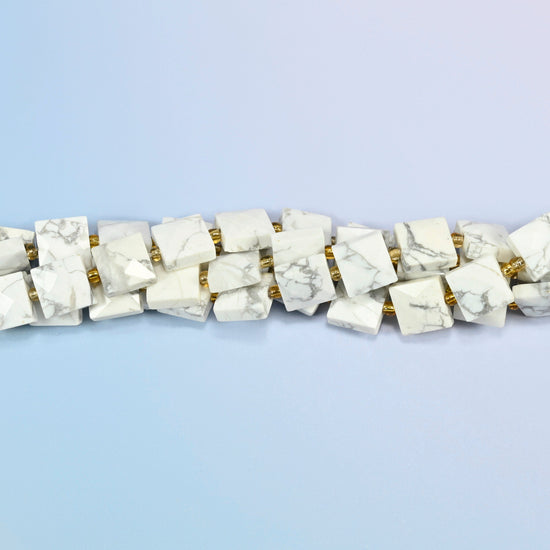 Strands of white howlite faceted flat square beads twisted together in a horizontal row