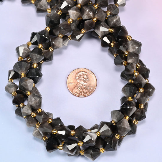Silver obsidian bicone beads coiled into a round ring, 8mm and 10mm sizes available, gold-tone spacers throughout.