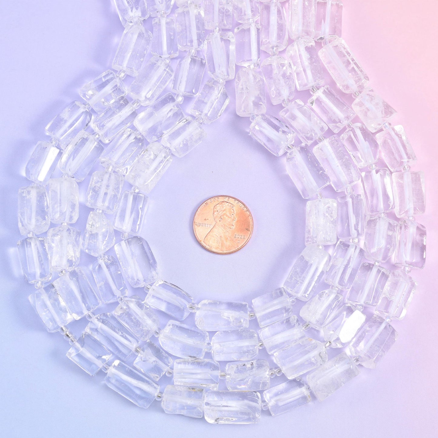 Coiled strands with a penny centred inside, a quick way to judge tube width before ordering