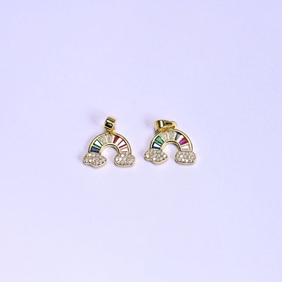 Two gold Rainbow Zirconia Charms side by side, 18K gold plated arcs of multicolor baguette zirconia resting on pave zirconia clouds.