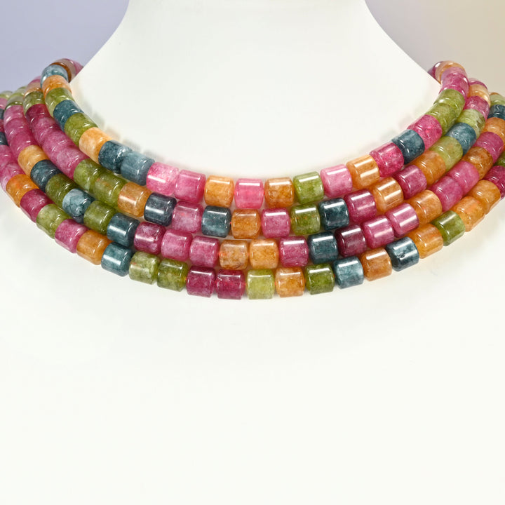 Tourmaline Color Dyed Jade cylinder tube beads 8x8mm shown on a white display neck form, four strands of mixed rose pink, olive green, warm orange and teal blue