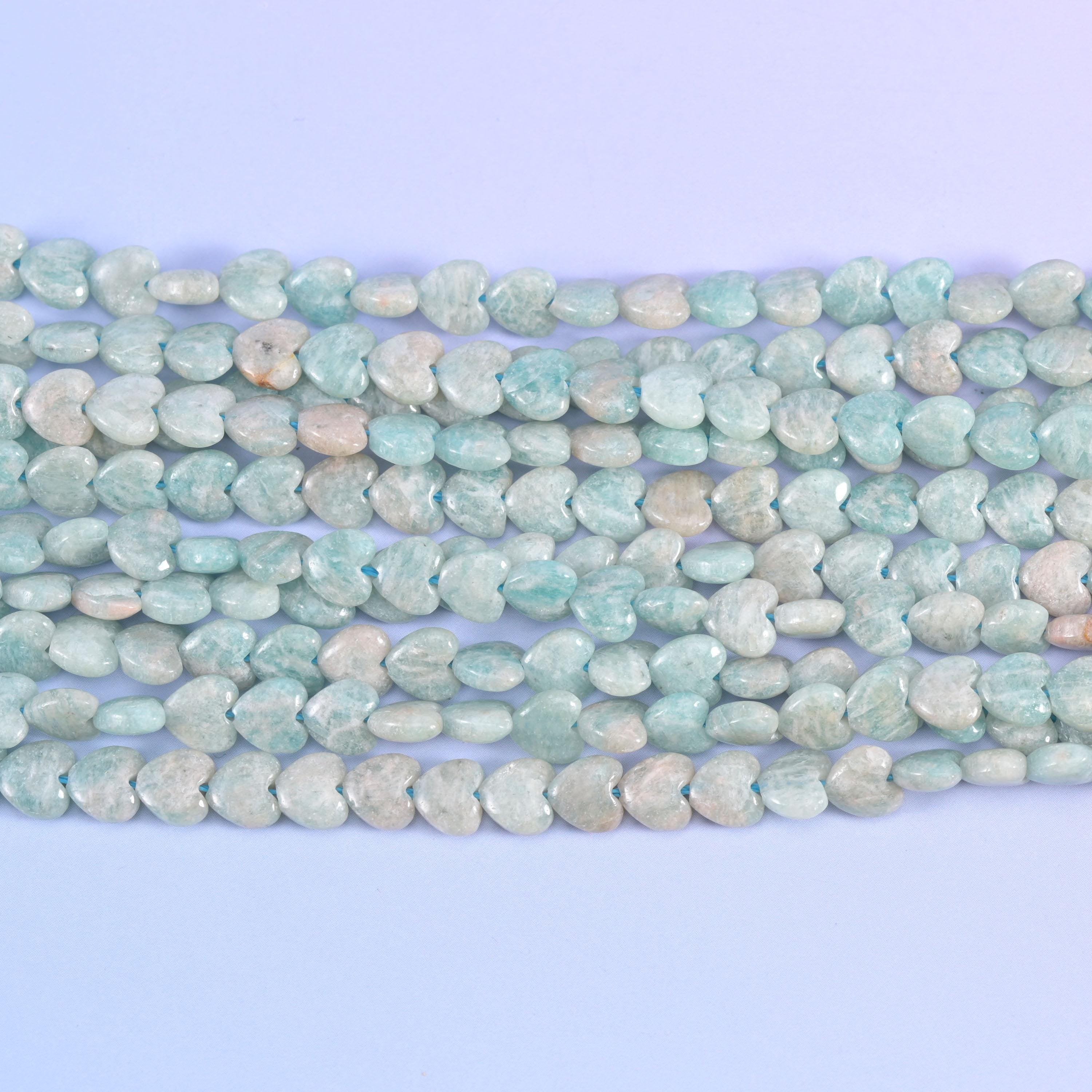 Close horizontal view of Blue Amazonite hearts with creamy beige patches