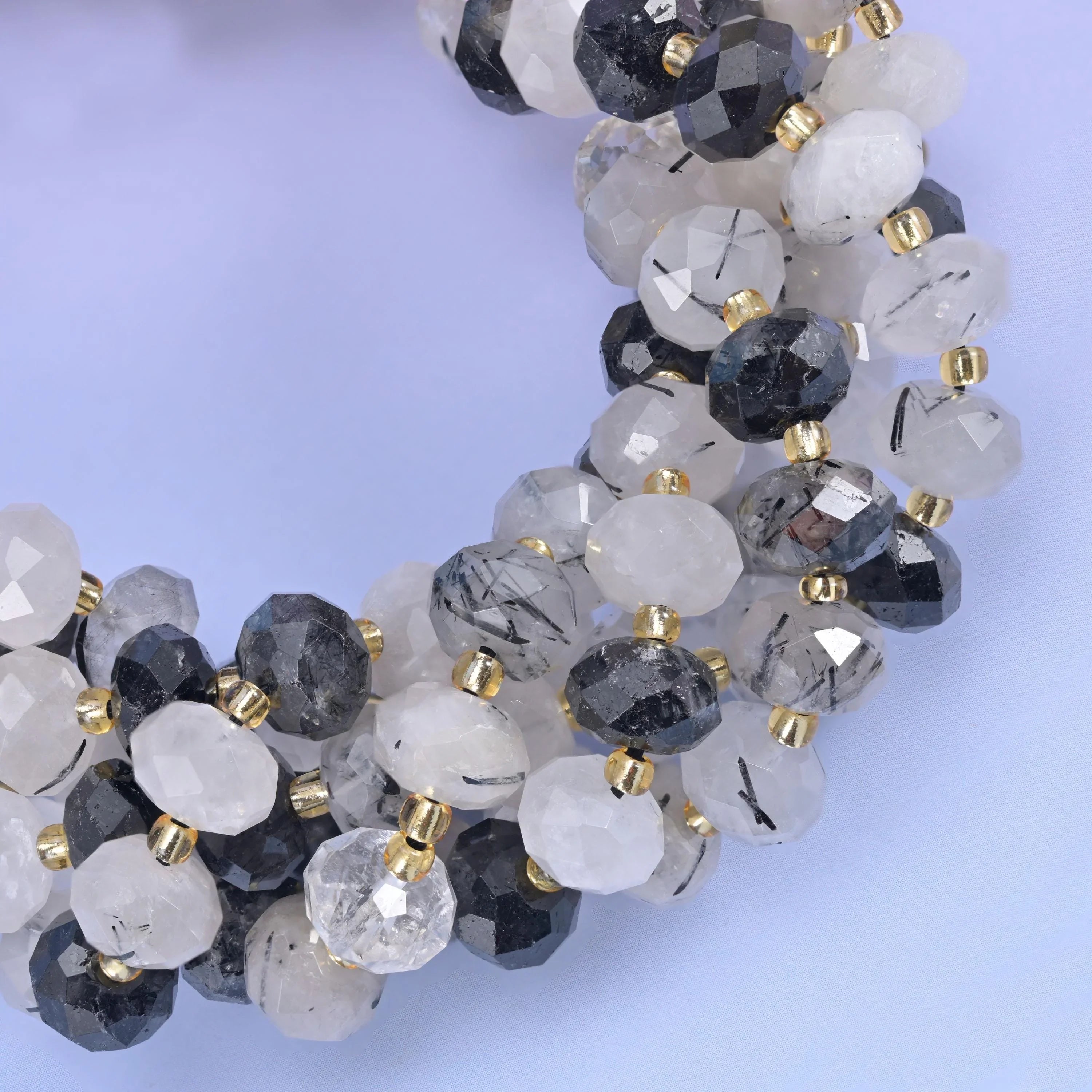 Faceted rondelle cut black rutilated quartz beads