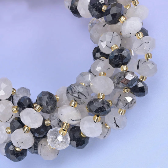 Faceted rondelle cut black rutilated quartz beads