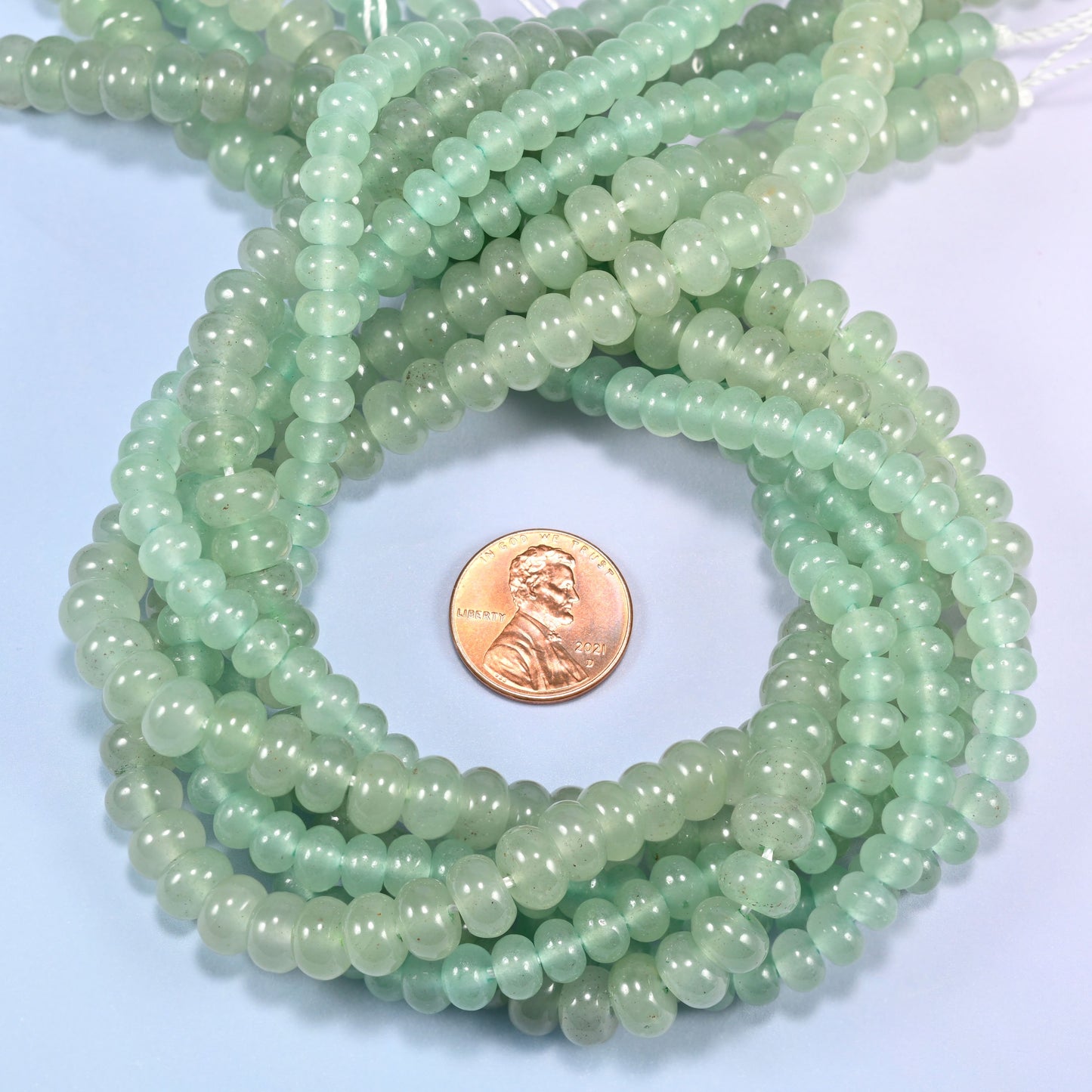 Green Aventurine gemstone rondelle beads coiled flat, smooth 4x6mm and 5x8mm discs on a 15.5 inch strand