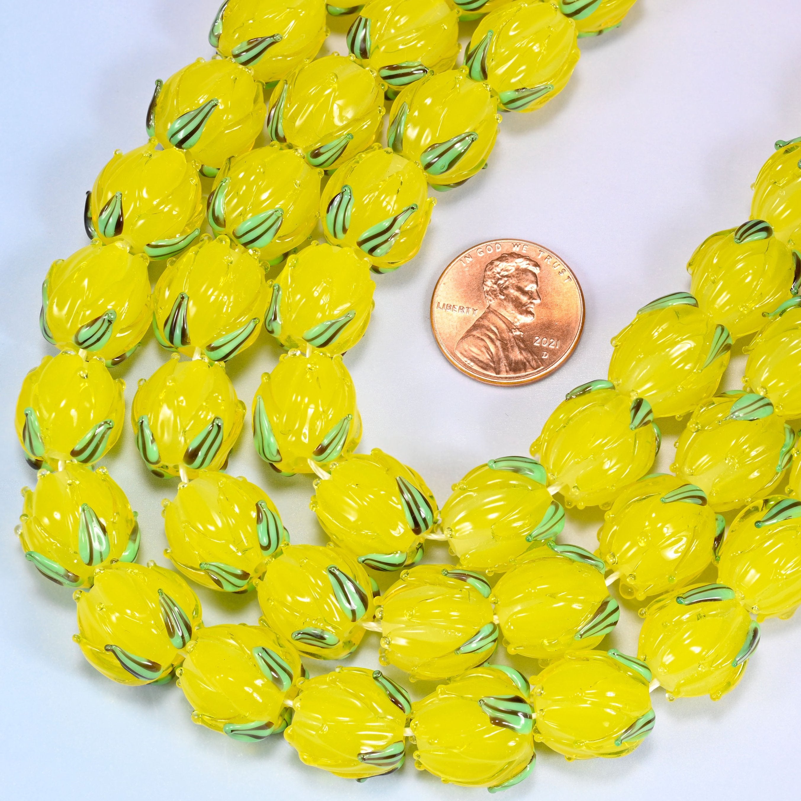 Hand-formed lampwork glass tulip bud beads with sculpted petal detailing