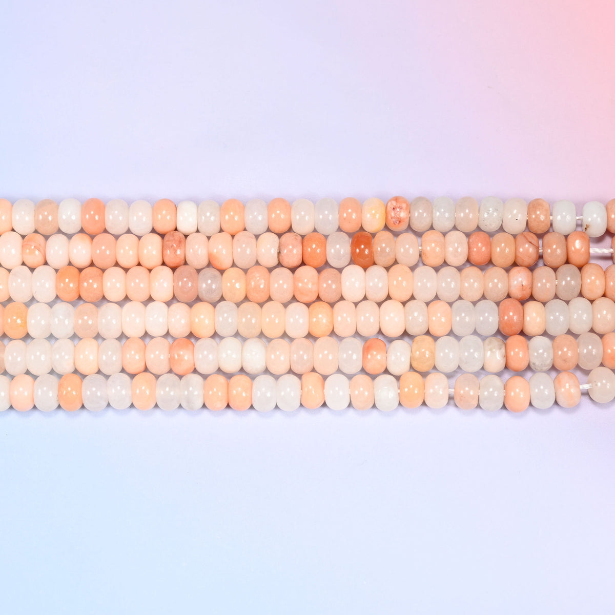 Natural Pink Aventurine Rondelle Beads in soft blush, peach and creamy white tones.