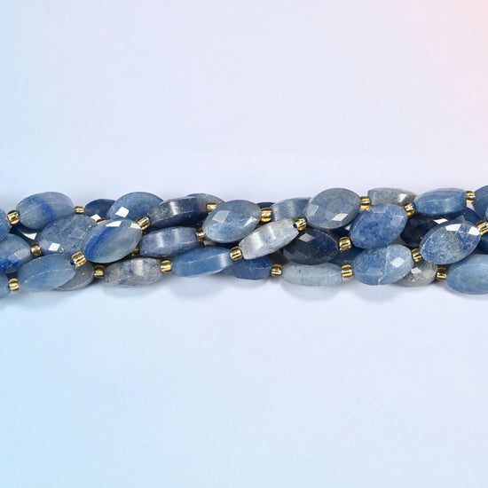 Strands of blue aventurine faceted flat oval beads twisted together in a horizontal row
