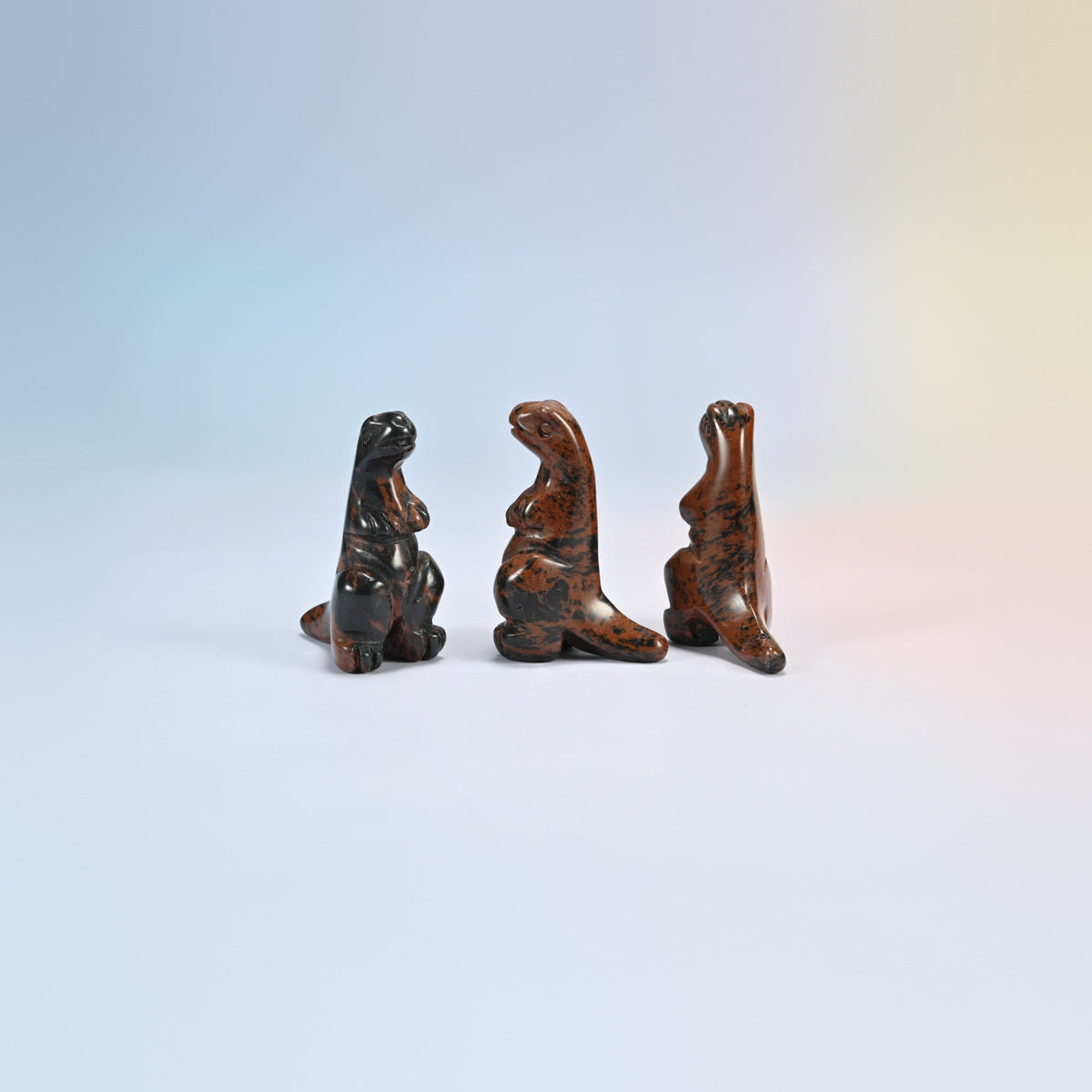 Three golden swan T-Rex dinosaur crystal carvings, 2 inch, black and red-brown natural stone