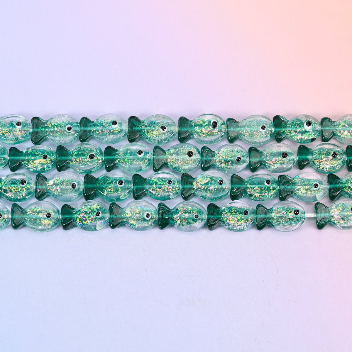 Iridescent Green Fish Glass Beads in sea green with gold glitter
