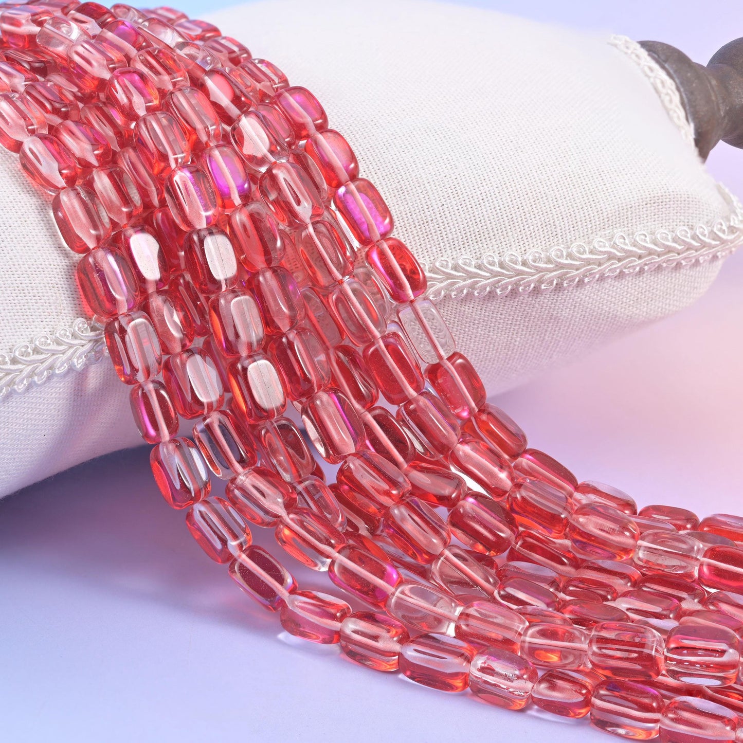 Red Mystic Aura glass beads in a rectangular cut with a glossy transparent finish