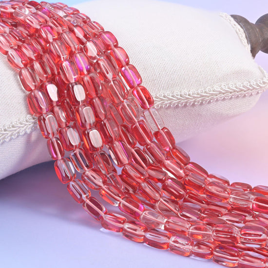 Red Mystic Aura glass beads in a rectangular cut with a glossy transparent finish