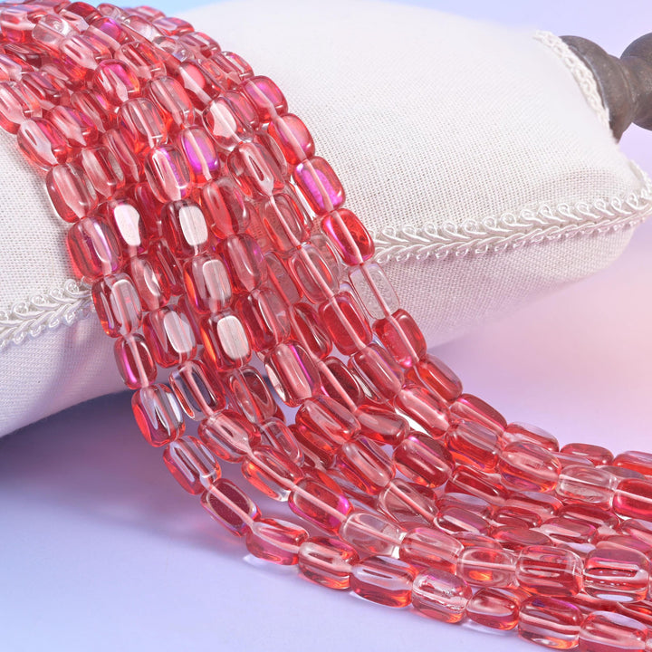 Red Mystic Aura glass beads in a rectangular cut with a glossy transparent finish