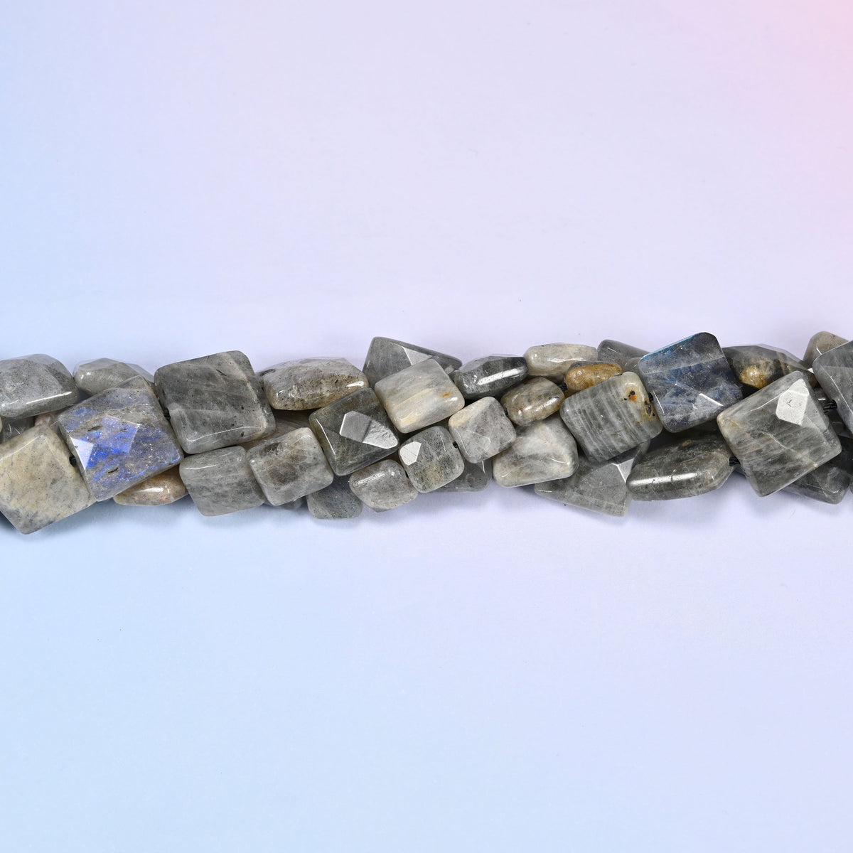 Gray Labradorite faceted flat square beads in a single close run, the flat front of each tile catching the light