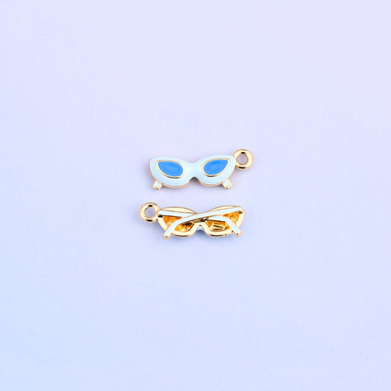 White cat eye sunglasses charm with blue lenses, front and back.