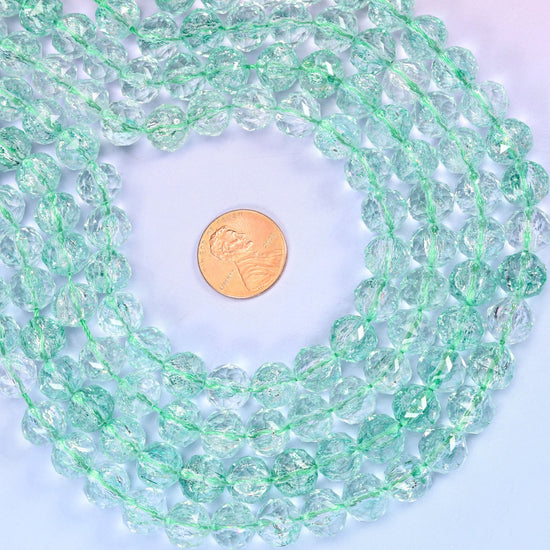 Transparent Green Faceted Round Glass Beads, cut with many small facets