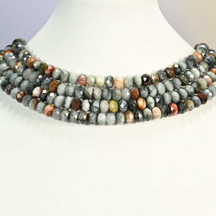 Eagle eye jasper faceted rondelle beads on a white neck display, four strands around the bust.