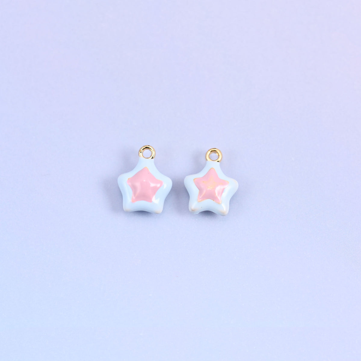 Light blue star charms with a light pink inset star, glossy enamel over 18K gold plated brass.