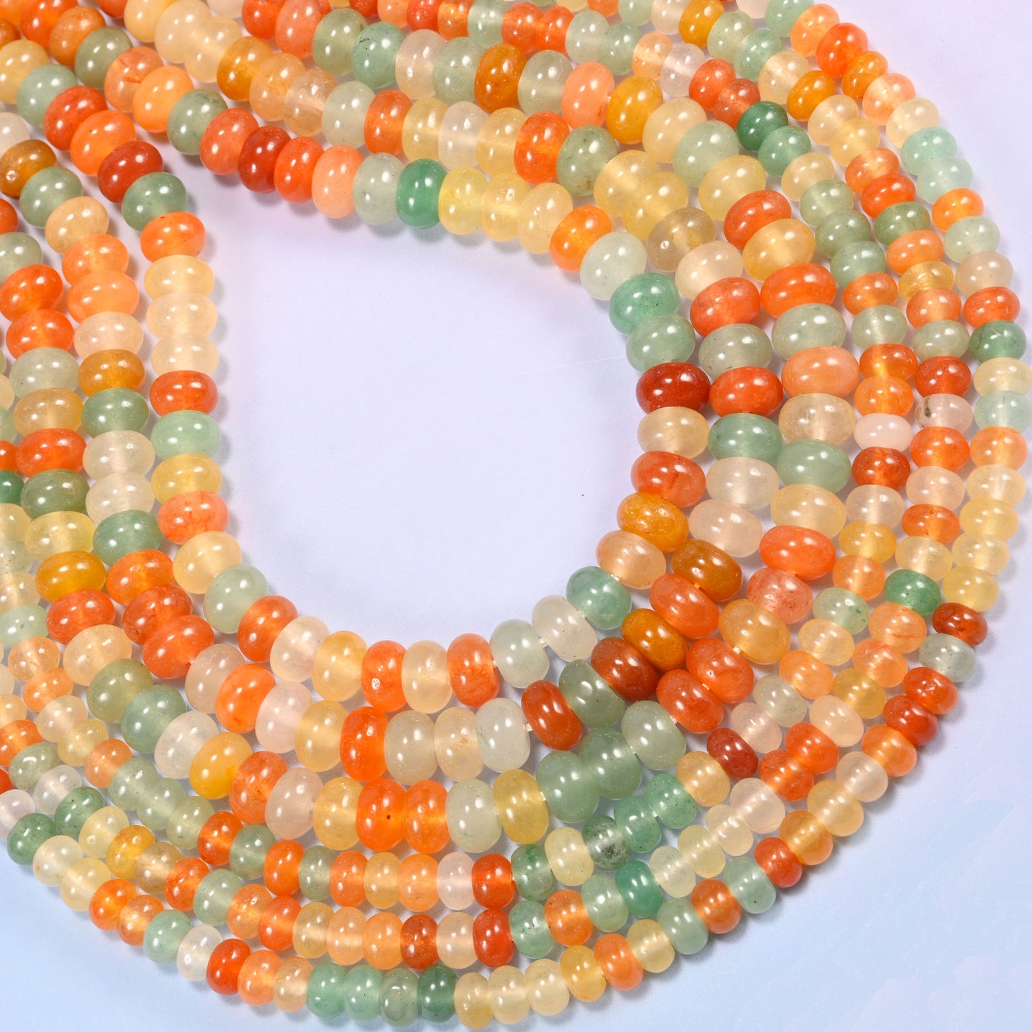 Gold Silk Jade gemstone rondelle beads coiled into a rounded loop, a 15.5 inch strand holding about 90 or 76 beads