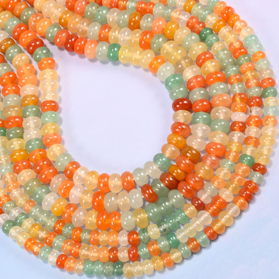 Gold Silk Jade gemstone rondelle beads coiled into a rounded loop, a 15.5 inch strand holding about 90 or 76 beads