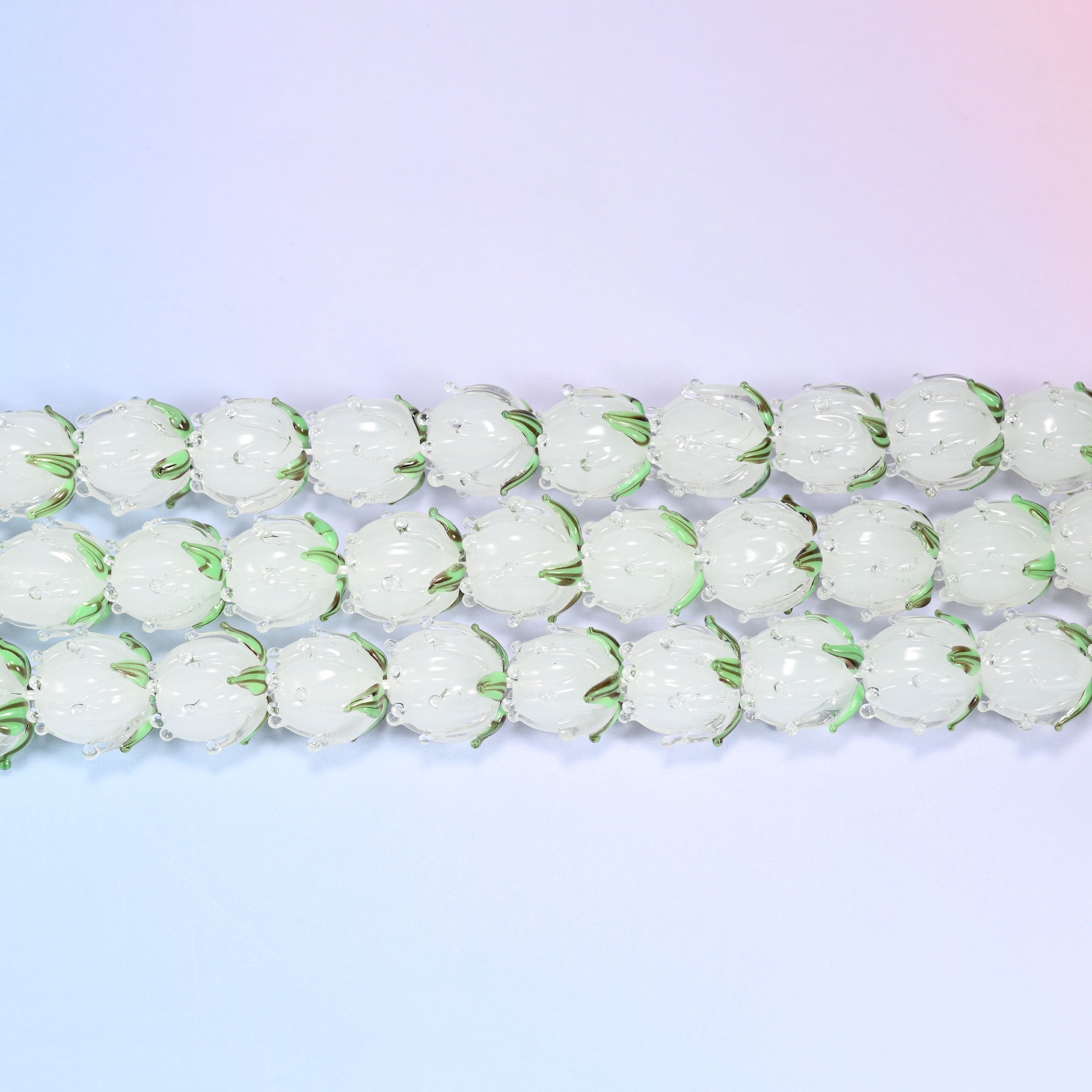 Tulip flower bud lampwork glass beads in frosted white with green leaf detail