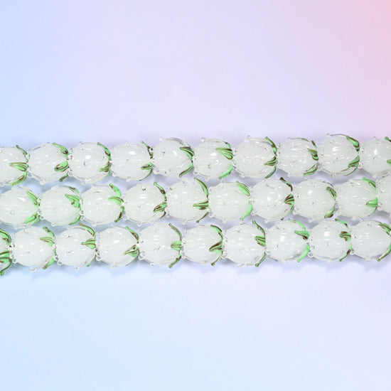Tulip flower bud lampwork glass beads in frosted white with green leaf detail