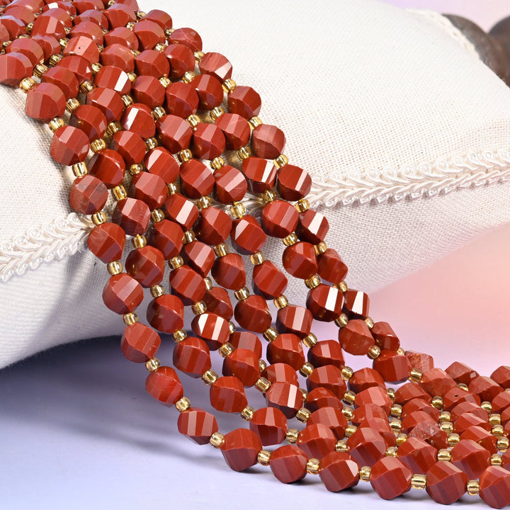 Red Jasper Faceted Spiral Twist Beads in solid brick red, opaque and evenly coloured.