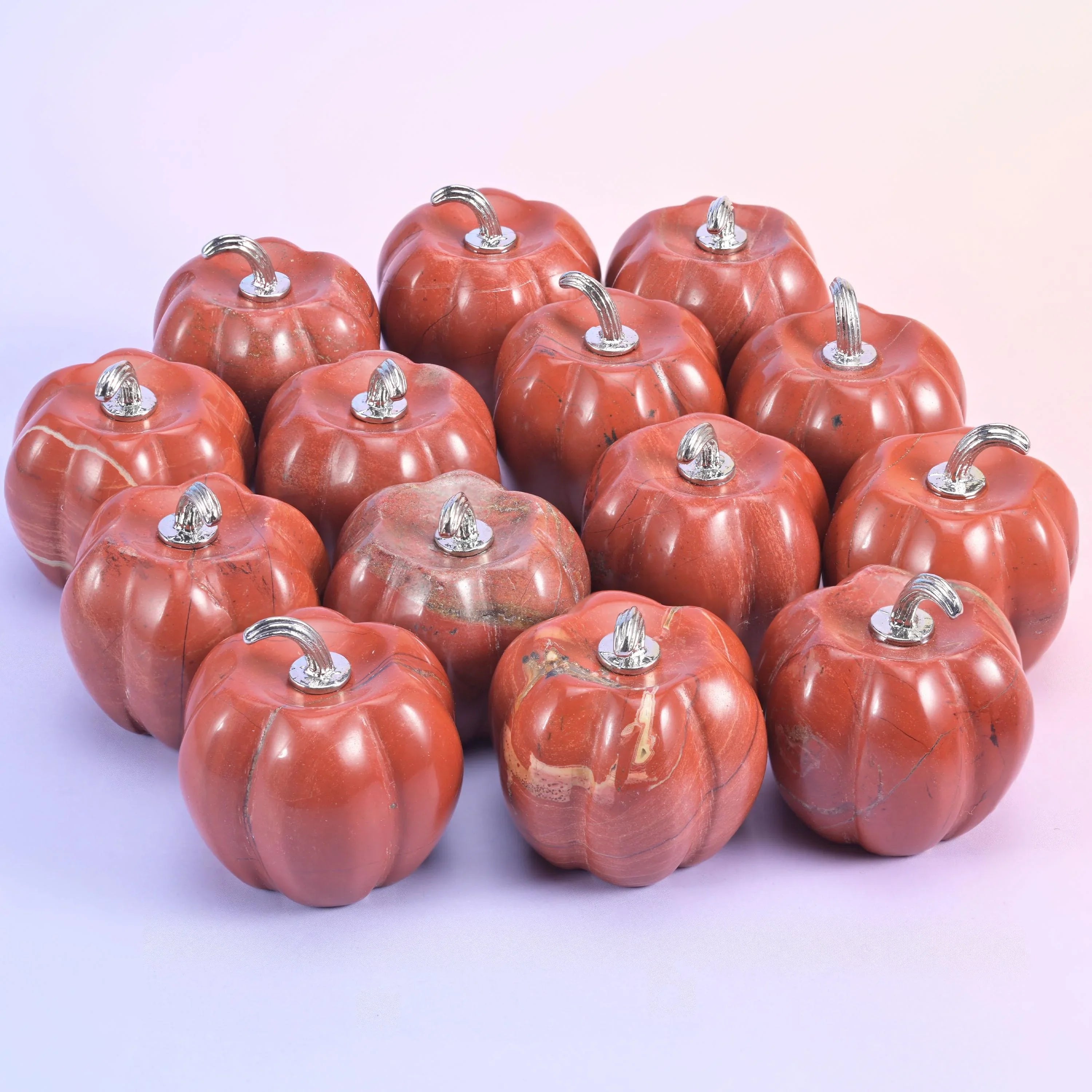 1.2 inch carved pumpkin, about 1.2 oz, polished on all faces and topped with a metal stem