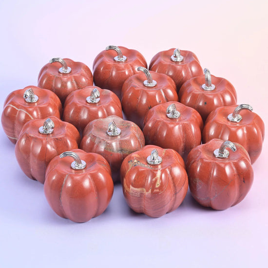 1.2 inch carved pumpkin, about 1.2 oz, polished on all faces and topped with a metal stem