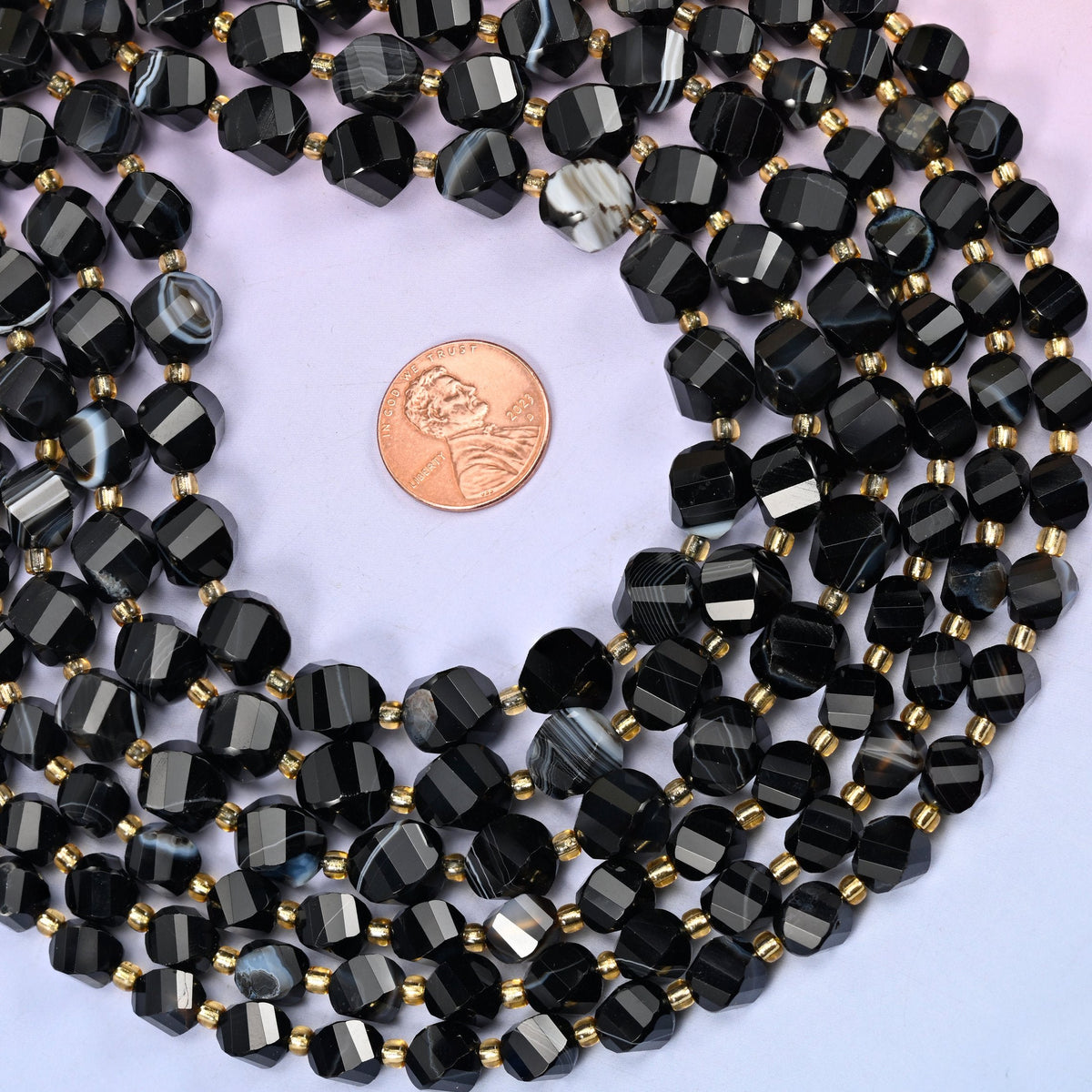 Colour-treated black agate with natural white banding across each bead