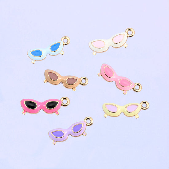 All eight cat eye sunglasses colorways scattered together.