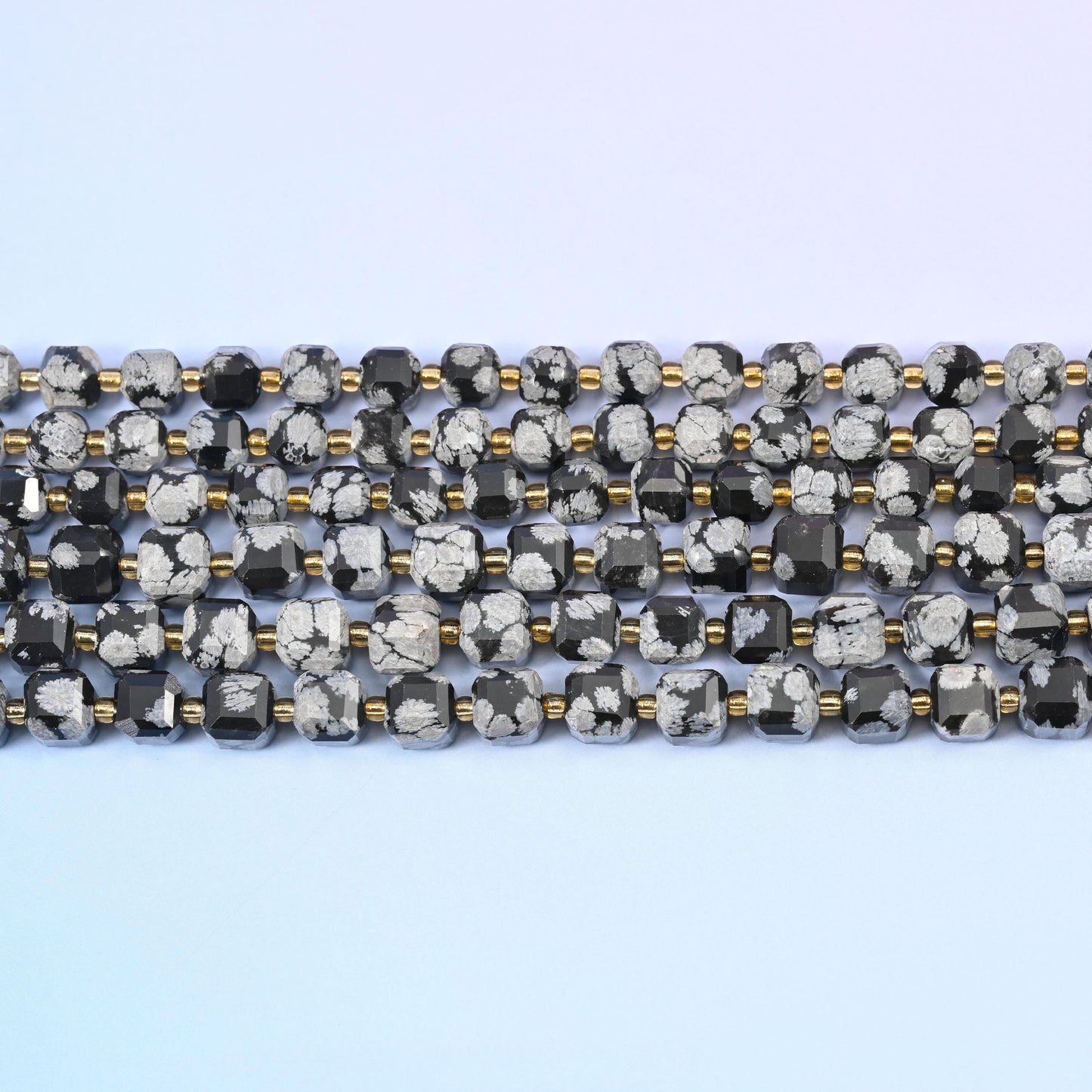 Snowflake Jasper Faceted Cube Beads in glossy black with chalky white patches