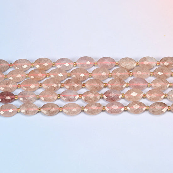 Several strands of strawberry quartz faceted flat oval beads laid in straight rows with gold seed bead spacers