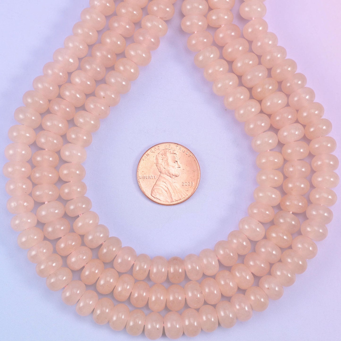 Soft Pink Dyed Jade Smooth Rondelle Beads, an even blush pink with a faint warm peach cast, glossy and semi-translucent