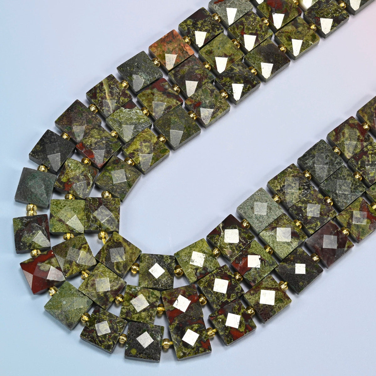 Natural dragon blood stone faceted flat square beads in several strands curved into a wide U, olive green stone with dark red patches