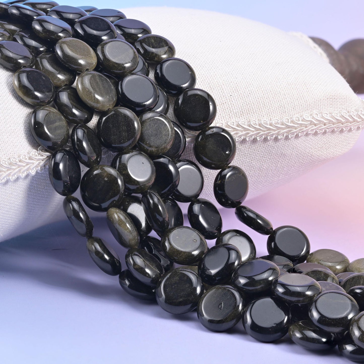 Natural Gold Obsidian smooth coin beads in flat black with a warm bronze-gold shimmer