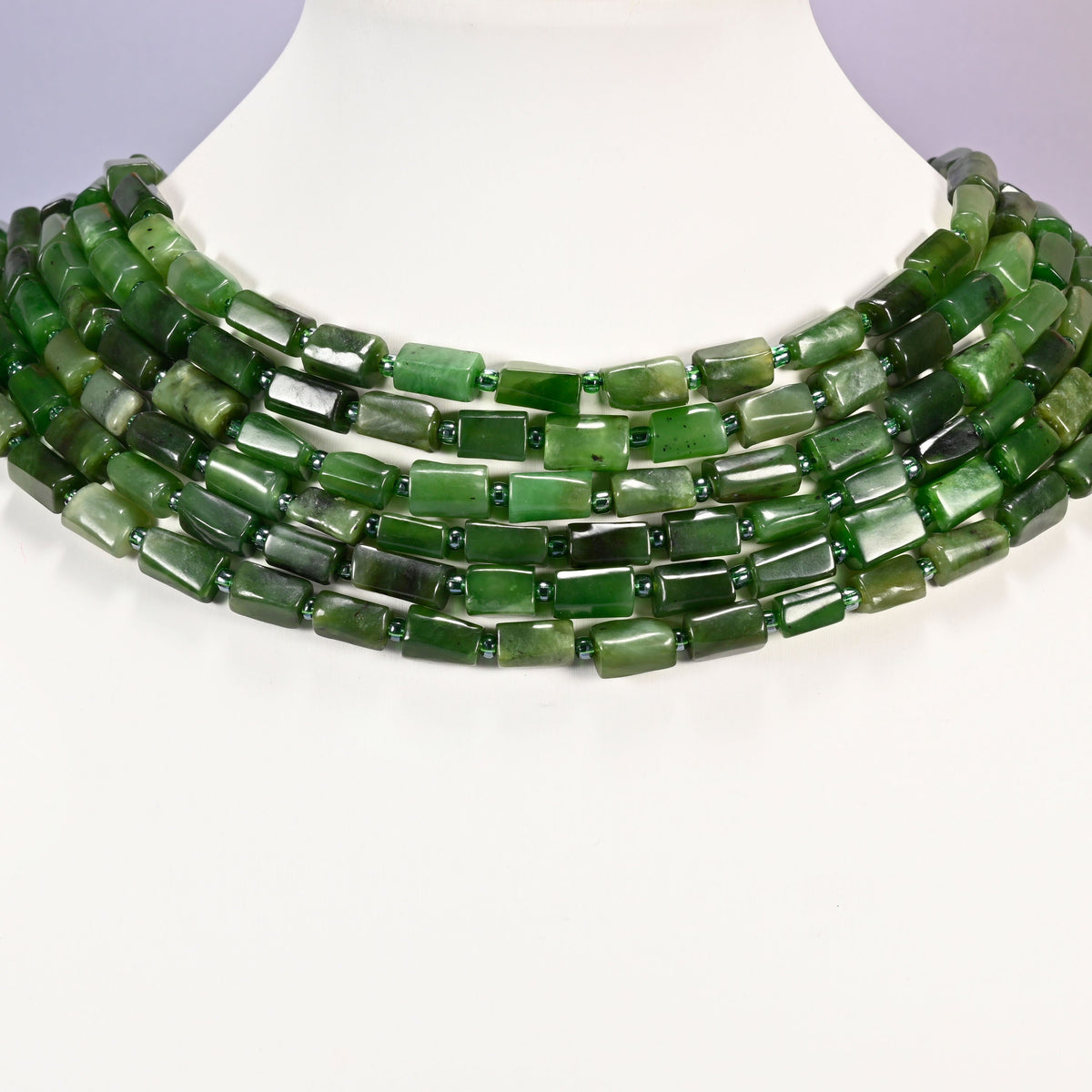 Canadian Green Jade faceted tube beads laid in four graduated collar rows, 8x7mm to 12x7mm deep green tubes with lighter sage banding