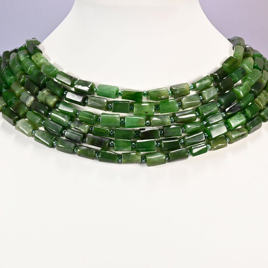Canadian Green Jade faceted tube beads laid in four graduated collar rows, 8x7mm to 12x7mm deep green tubes with lighter sage banding