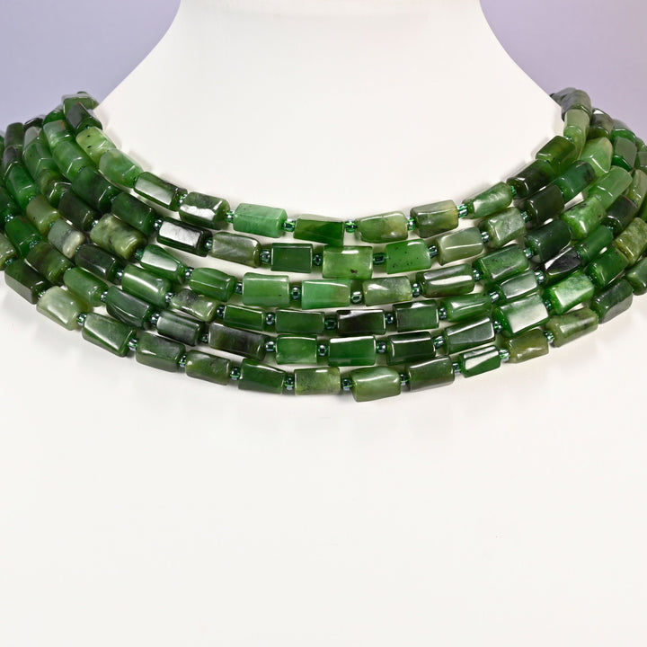 Canadian Green Jade faceted tube beads laid in four graduated collar rows, 8x7mm to 12x7mm deep green tubes with lighter sage banding